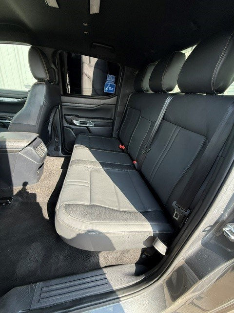 Ford Ranger 2-Seat Commercial rear seat conversion fitted in the double cab, viewed from the open rear door with the bench and headrests in place