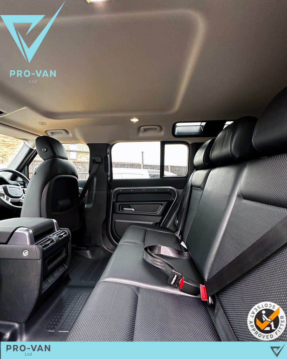 Defender 110 Commercial rear bench seat conversion seen through the open rear door