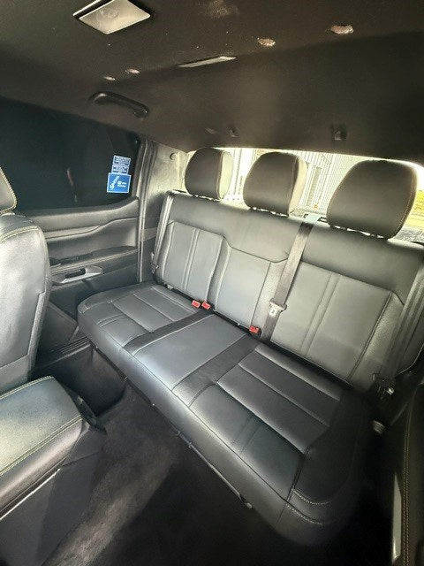 Wide interior view of the Ford Ranger double cab with the 2-Seat Commercial rear seat conversion fitted, showing the full bench, three headrests and seatbelts