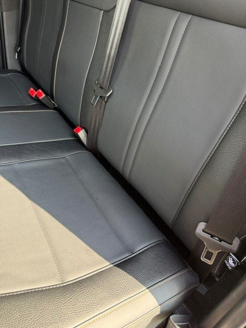 Close-up of the bench cushion and backrest on the Ford Ranger 2-Seat Commercial rear seat conversion, with all three seatbelt buckle stalks in place